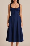 Navy blue dress worn by a model on a beige background