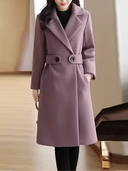 Purple coat worn by a person with a blurred background