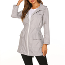 Gray raincoat worn by a person on a white background