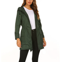 Green raincoat worn by a model on a white background
