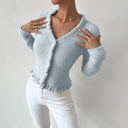 Light blue knitted cardigan worn by a mannequin against a plain background