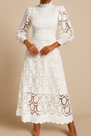 White lace dress on a beige background