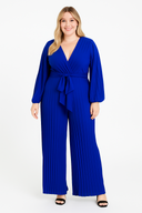 Woman wearing a blue jumpsuit on a white background