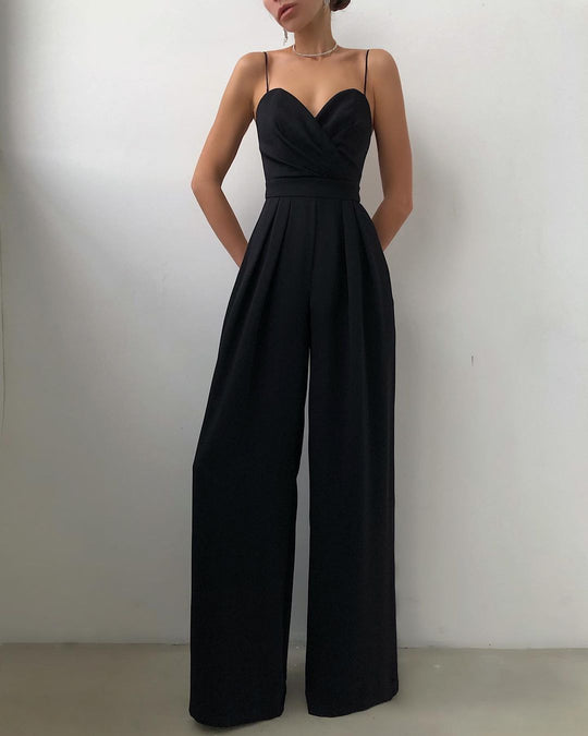 Black jumpsuit worn by a person against a plain background