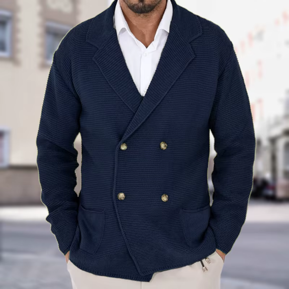 Man wearing a navy blue double-breasted jacket with gold buttons on a blurred street background