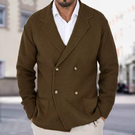 Man wearing a brown double-breasted jacket with a blurred street background