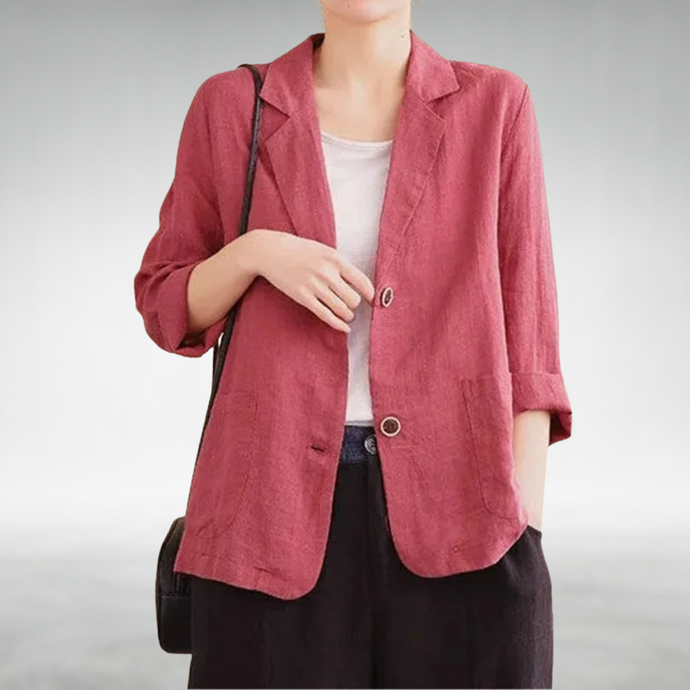 Person wearing a red jacket on a plain background