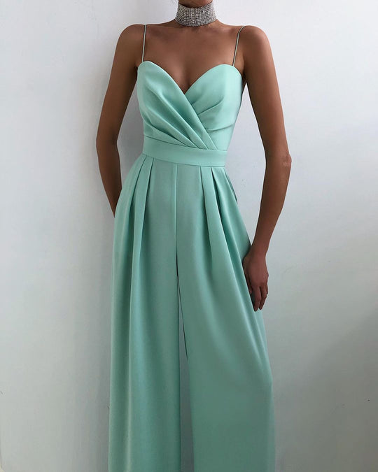 Women With Mint green jumpsuit gown on a plain background