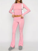 Person wearing a pink outfit with a white background