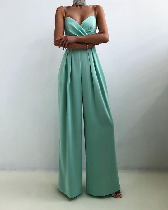 Mint green strapless jumpsuit on a plain background