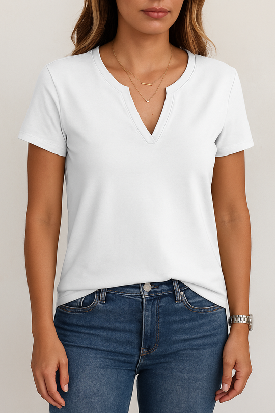 Person wearing a white t-shirt and blue jeans against a neutral background