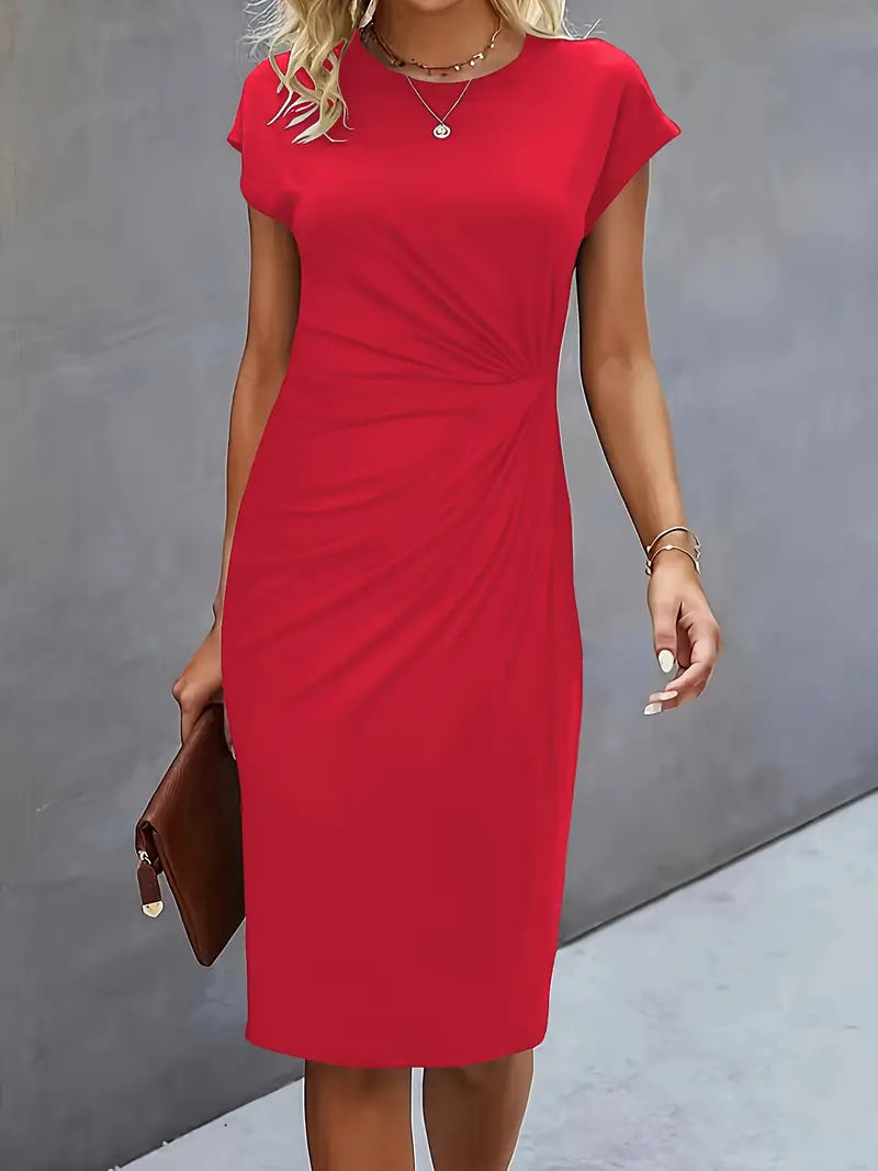 Red dress worn by a person against a gray background