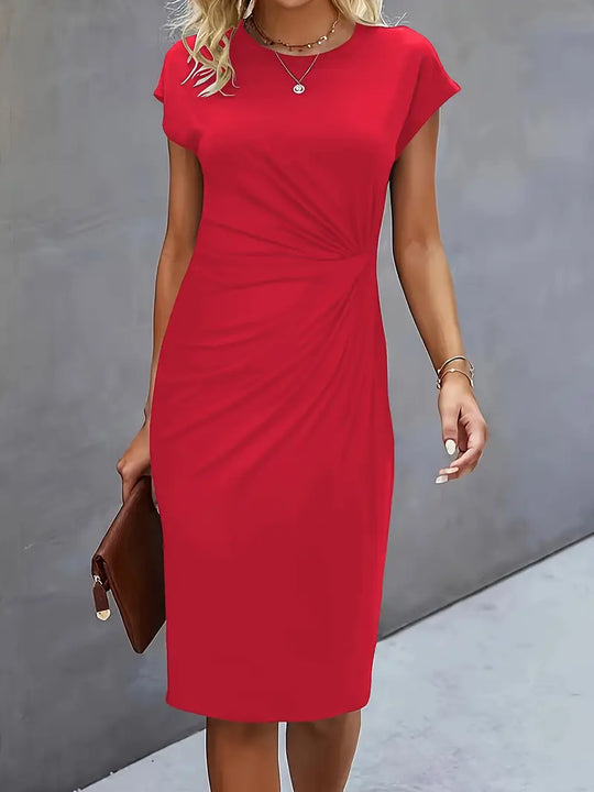 Red dress worn by a person against a gray background