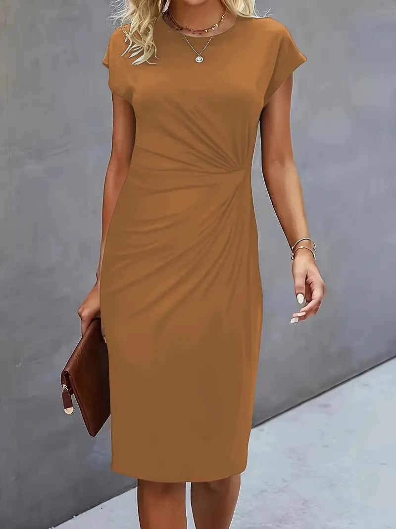 Woman wearing a brown dress against a gray background