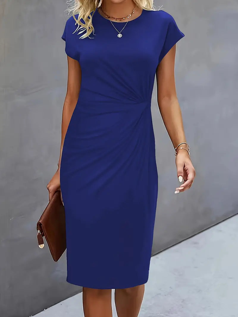 Woman wearing a blue dress against a gray background