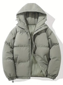 Green puffer jacket with a hood on a white background