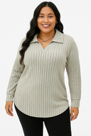 Woman wearing a ribbed sweater with a collar on a white background