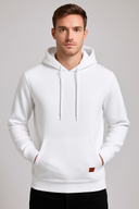 Man wearing a white hoodie on a gray background