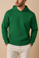 Person wearing a green hoodie against a beige background