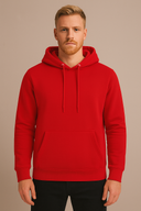 Man wearing a red hoodie against a beige background