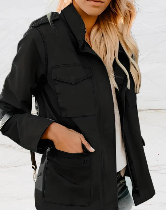 Person wearing a black jacket with a white background