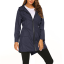 Navy blue raincoat worn by a model on a white background