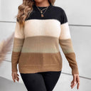 Person wearing a black, beige, and brown striped sweater holding a clutch.