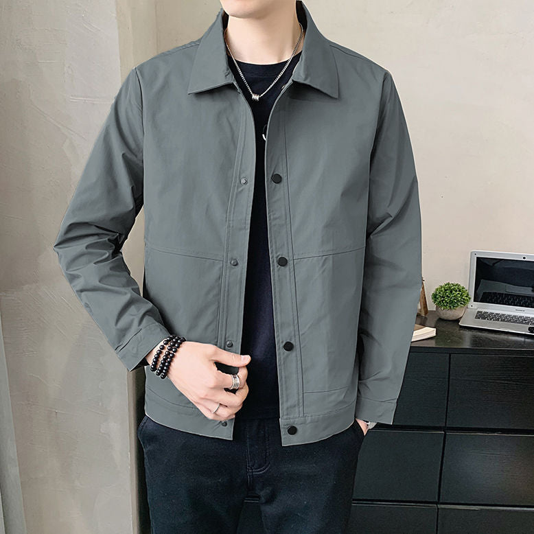 Person wearing a gray jacket in an indoor setting