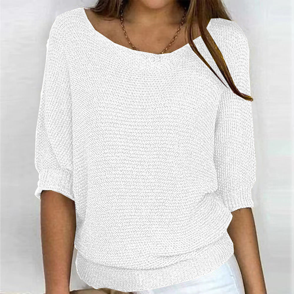 White textured top worn by a person on a plain background