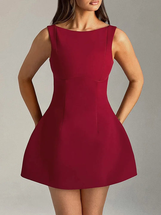 Red dress worn by a model on a plain background
