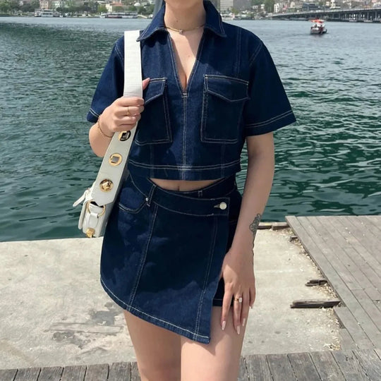 Person wearing a denim outfit by a waterfront