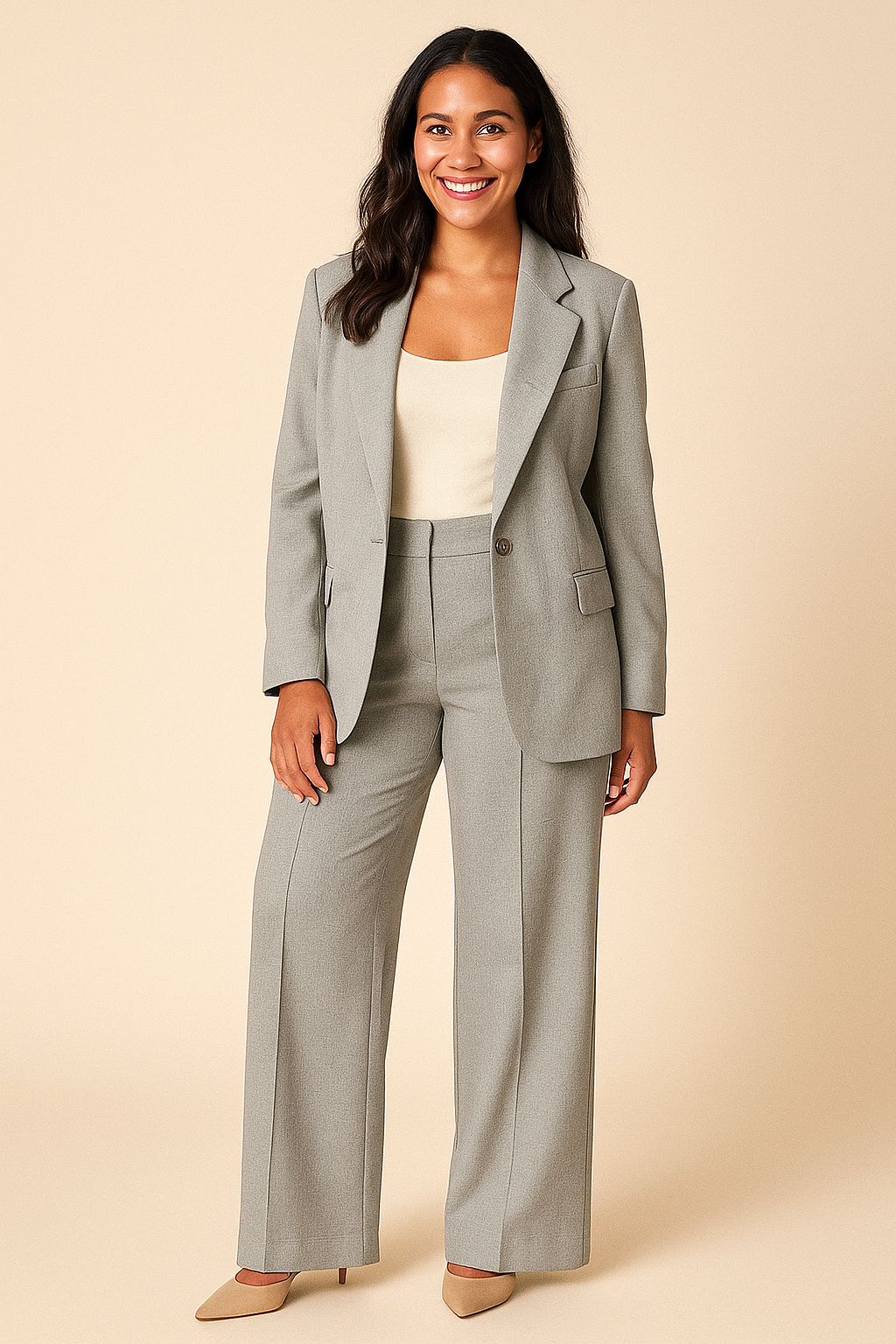 Woman wearing a gray suit with a beige background