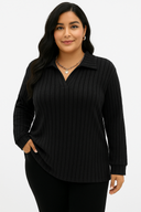 Woman wearing a black ribbed sweater on a white background