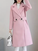 Person wearing a pink coat with a plain background