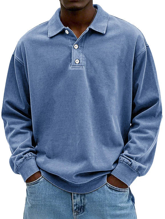Person wearing a blue long-sleeve polo shirt on a white background