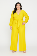Woman wearing a yellow jumpsuit on a white background